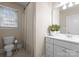Well-lit bathroom features a shower and a large vanity with white countertop at 1025 Seminole Dr, Waxhaw, NC 28173