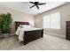 This carpeted bedroom features a ceiling fan and a window for natural light at 1025 Seminole Dr, Waxhaw, NC 28173