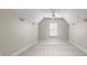Large, carpeted empty bedroom with a window, ceiling fan, and sconce lighting at 1025 Seminole Dr, Waxhaw, NC 28173