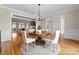 Elegant dining area with hardwood floors, modern lighting, and seamless entryways at 1025 Seminole Dr, Waxhaw, NC 28173