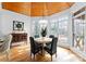 Bright dining room featuring a wood plank ceiling, many windows, and hardwood floors at 1025 Seminole Dr, Waxhaw, NC 28173