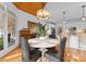 Dining room with wood plank ceiling, hanging chandelier, and access to the kitchen and living room at 01025 Seminole Dr, Waxhaw, NC 28173