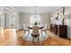 Formal dining room featuring a round table, hardwood floors, and ample natural light at 1025 Seminole Dr, Waxhaw, NC 28173