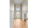 Grand foyer boasting soaring ceilings, hardwood floors, and a stunning chandelier at 1025 Seminole Dr, Waxhaw, NC 28173