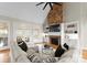 Inviting living room featuring a stone fireplace, built-in shelves, and comfortable sectional sofa at 1025 Seminole Dr, Waxhaw, NC 28173