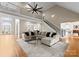 Spacious living room with a high ceiling, staircase, and plush seating arrangement at 1025 Seminole Dr, Waxhaw, NC 28173