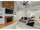 Cozy living space with a stone fireplace, built-in cabinetry, and a vaulted ceiling at 1025 Seminole Dr, Waxhaw, NC 28173