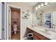 Well-lit bathroom featuring tile flooring, a vanity with ample storage, and a separate toilet room, offering both style and functionality at 1005 Forbishire Dr, Matthews, NC 28104