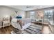 Comfortable bedroom with hardwood floors, a ceiling fan, a desk area, and natural light creating a cozy and inviting space at 1005 Forbishire Dr, Matthews, NC 28104