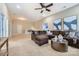 Expansive bonus room with plush carpeting, a comfortable sectional sofa, and ample space for various activities at 1005 Forbishire Dr, Matthews, NC 28104
