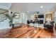 Comfortable living room with fireplace, hardwood floors, and natural light at 1005 Forbishire Dr, Matthews, NC 28104