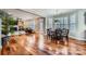 Sun-filled Living spaces with open floorplan featuring hardwood floors and large windows at 1005 Forbishire Dr, Matthews, NC 28104
