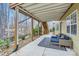 Patio featuring an outdoor sofa with cushions and steps leading to upper deck at 1005 Forbishire Dr, Matthews, NC 28104