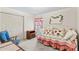 Bright bedroom with a daybed, cute ladybug themed decorations and a leafy mirror at 101 Fairfax Dr, Salisbury, NC 28146