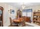 Elegant dining room with a wooden table set, classic chandelier, and built-in display cabinet at 101 Fairfax Dr, Salisbury, NC 28146