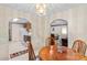 Open dining area showcases arched entryways to the kitchen and living room, complemented by wooden furniture at 101 Fairfax Dr, Salisbury, NC 28146