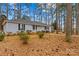 Inviting home with a well-manicured lawn and mature trees, complemented by light blue siding and black shutters at 101 Fairfax Dr, Salisbury, NC 28146
