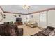 Charming living space with carpeted floors, a ceiling fan, and comfortable seating options at 101 Fairfax Dr, Salisbury, NC 28146