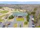 Aerial view of the community clubhouse and golf course showcasing the beautiful landscaping at 1025 Seminole Dr, Waxhaw, NC 28173