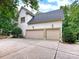 Three-car garage with ample parking space and well-manicured landscaping at 1025 Seminole Dr, Waxhaw, NC 28173