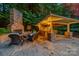 Inviting outdoor fireplace with built-in bar and seating for entertaining at 1025 Seminole Dr, Waxhaw, NC 28173