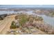 Wide aerial perspective of a lake community, blending residential areas and a large, forested natural reserve at 108 Outside Loop Ln, Mooresville, NC 28117