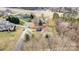 An aerial shot of houses with lovely landscaping and a long, paved airstrip running through the neighborhood at 108 Outside Loop Ln, Mooresville, NC 28117