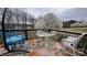 Outdoor deck featuring a seating area with a floral rug and a beautiful view of the lawn at 108 Outside Loop Ln, Mooresville, NC 28117