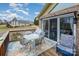 Relaxing deck with outdoor furniture, a view of a well-maintained home, and a landscaped yard at 108 Outside Loop Ln, Mooresville, NC 28117
