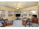 Spacious home office with ample natural light, a ceiling fan, and comfortable furniture at 108 Outside Loop Ln, Mooresville, NC 28117