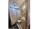 Bathroom with anchor-themed decor, bathtub-shower, and sink, designed for comfort and style at 110 Shawnee Trl, Mount Gilead, NC 27306
