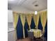 Charming dining area with decorative curtains, creating a unique and inviting space for meals at 110 Shawnee Trl, Mount Gilead, NC 27306