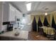 Cozy kitchen and dining space featuring white cabinets, modern appliances, and a dining table at 110 Shawnee Trl, Mount Gilead, NC 27306