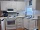 Well-equipped kitchen with bright countertops and ample cabinets at 110 Shawnee Trl, Mount Gilead, NC 27306