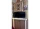 Corner cabinet in living room featuring TV and clock at 110 Shawnee Trl, Mount Gilead, NC 27306