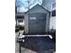 Large gray shed with double doors, decorative trim and a small picket fence at 110 Shawnee Trl, Mount Gilead, NC 27306