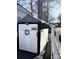 View of the shed with a white picket fence and nautical decor at 110 Shawnee Trl, Mount Gilead, NC 27306