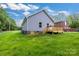 Exterior view of the home showing a wooden deck and grassy backyard at 117 Lippard St, Statesville, NC 28677