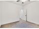Neutral bedroom with ceiling fan, closet and doorway at 117 Lippard St, Statesville, NC 28677