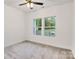 Bright bedroom has two windows and soft carpet at 117 Lippard St, Statesville, NC 28677