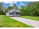 Attractive home with a well-kept lawn, concrete driveway, and welcoming front porch at 117 Lippard St, Statesville, NC 28677
