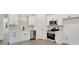 Modern kitchen featuring white cabinets, stainless steel appliances, and stylish countertops at 117 Lippard St, Statesville, NC 28677