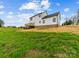 View of the home's backyard featuring the exterior, yard and blue sky at 1300 Austin Chaney Rd, Wingate, NC 28174