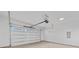 Spacious garage with finished walls and concrete flooring at 1300 Austin Chaney Rd, Wingate, NC 28174