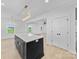 Kitchen featuring a large island with granite countertops, modern light fixtures, and an open view to the living area at 1300 Austin Chaney Rd, Wingate, NC 28174