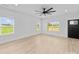 Bright, modern living room features a ceiling fan, light wood floors, and ample natural light at 1300 Austin Chaney Rd, Wingate, NC 28174