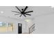 Bright, modern living room features a ceiling fan, light wood floors, and ample natural light at 1300 Austin Chaney Rd, Wingate, NC 28174