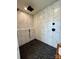 Modern shower featuring marble tile and stone flooring with black fixtures at 1300 Austin Chaney Rd, Wingate, NC 28174