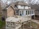 Multi-level back deck featuring built in seating and a gas grill, perfect for outdoor entertaining at 1816 Country Garden Dr, Shelby, NC 28150