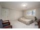 Cozy bedroom featuring a comfortable bed, carpeted floor, and built-in desk area bathed in natural light from shuttered windows at 1816 Country Garden Dr, Shelby, NC 28150